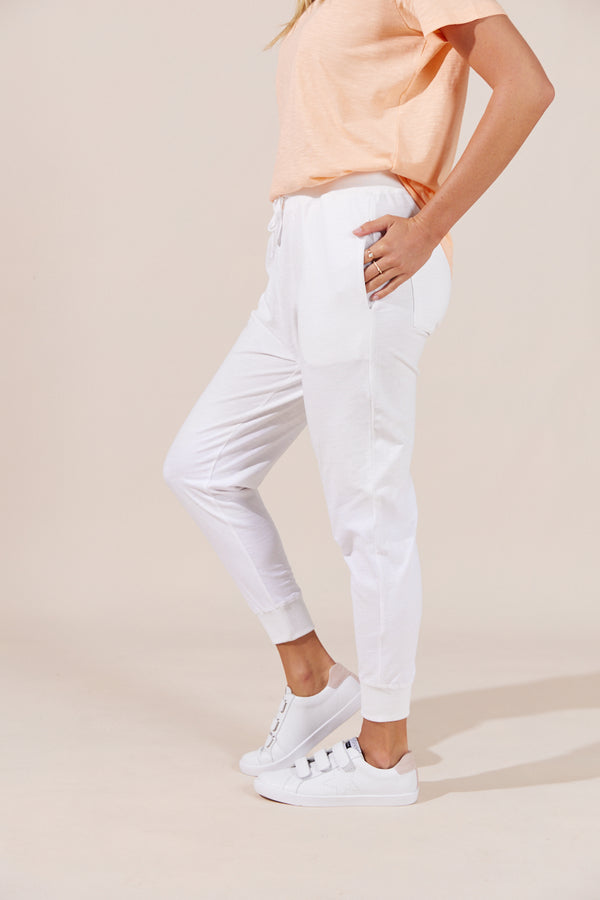 woman wearing white casual pants